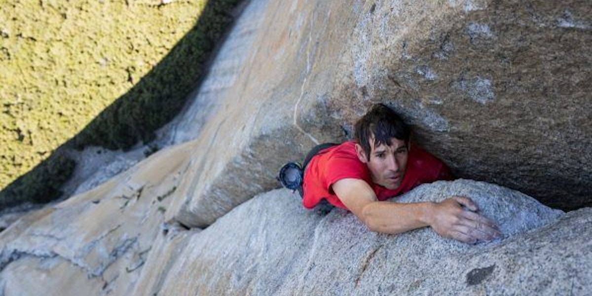A man climbing a cliff face