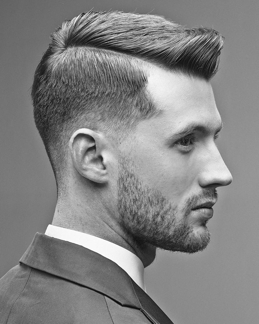 Classic Ivy League haircut with low taper fade