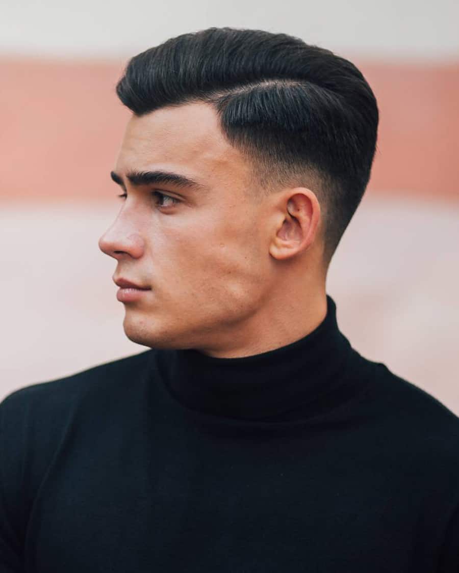 Men's side parting with low taper fade haircut