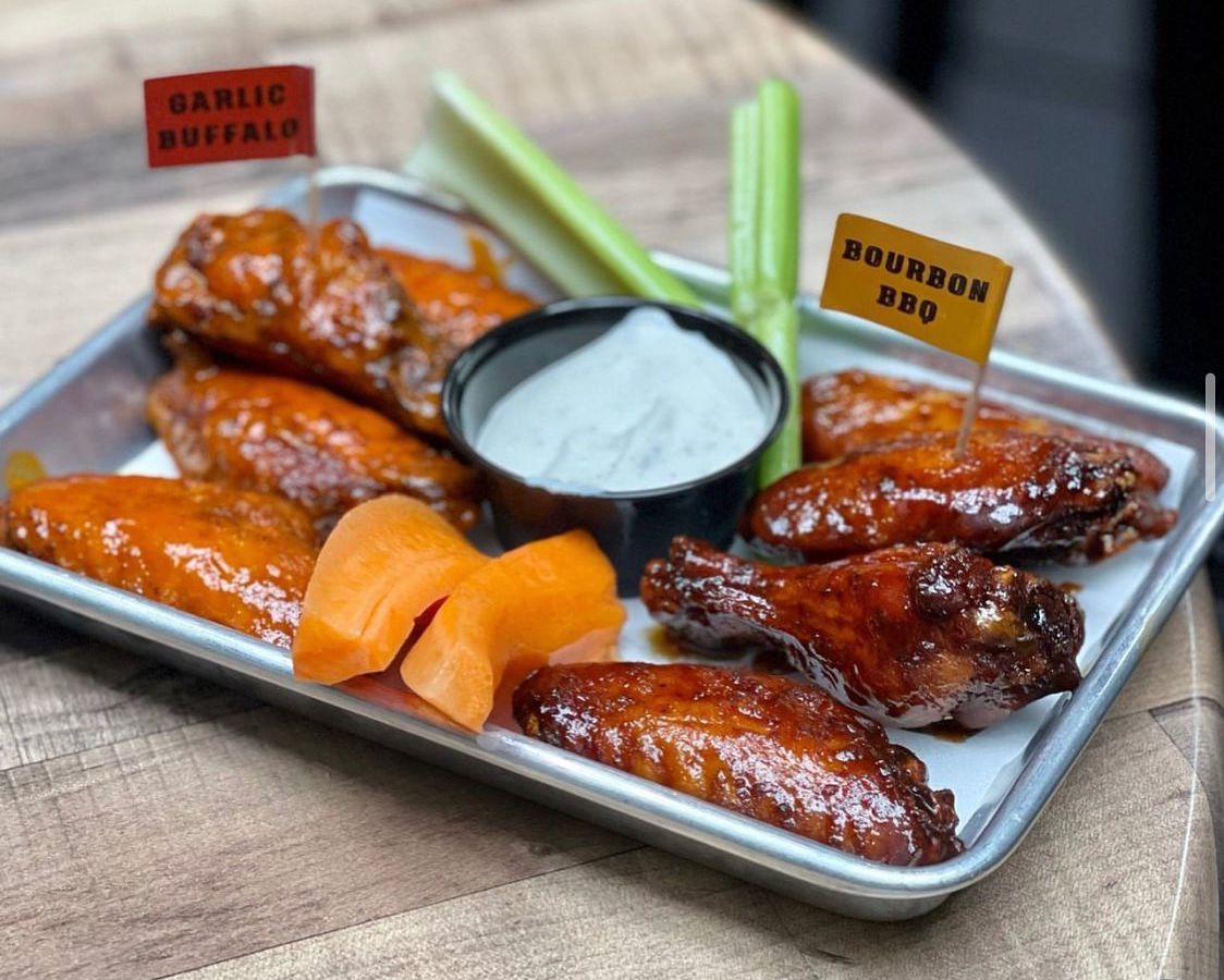 Six wings on a metal tray