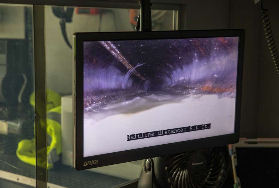 The footage from a camera in a sewer drain is shown on a monitor inside a Cedar Rapids sewer maintenance truck while on a job in Cedar Rapids on May 18. (Savannah Blake/The Gazette)